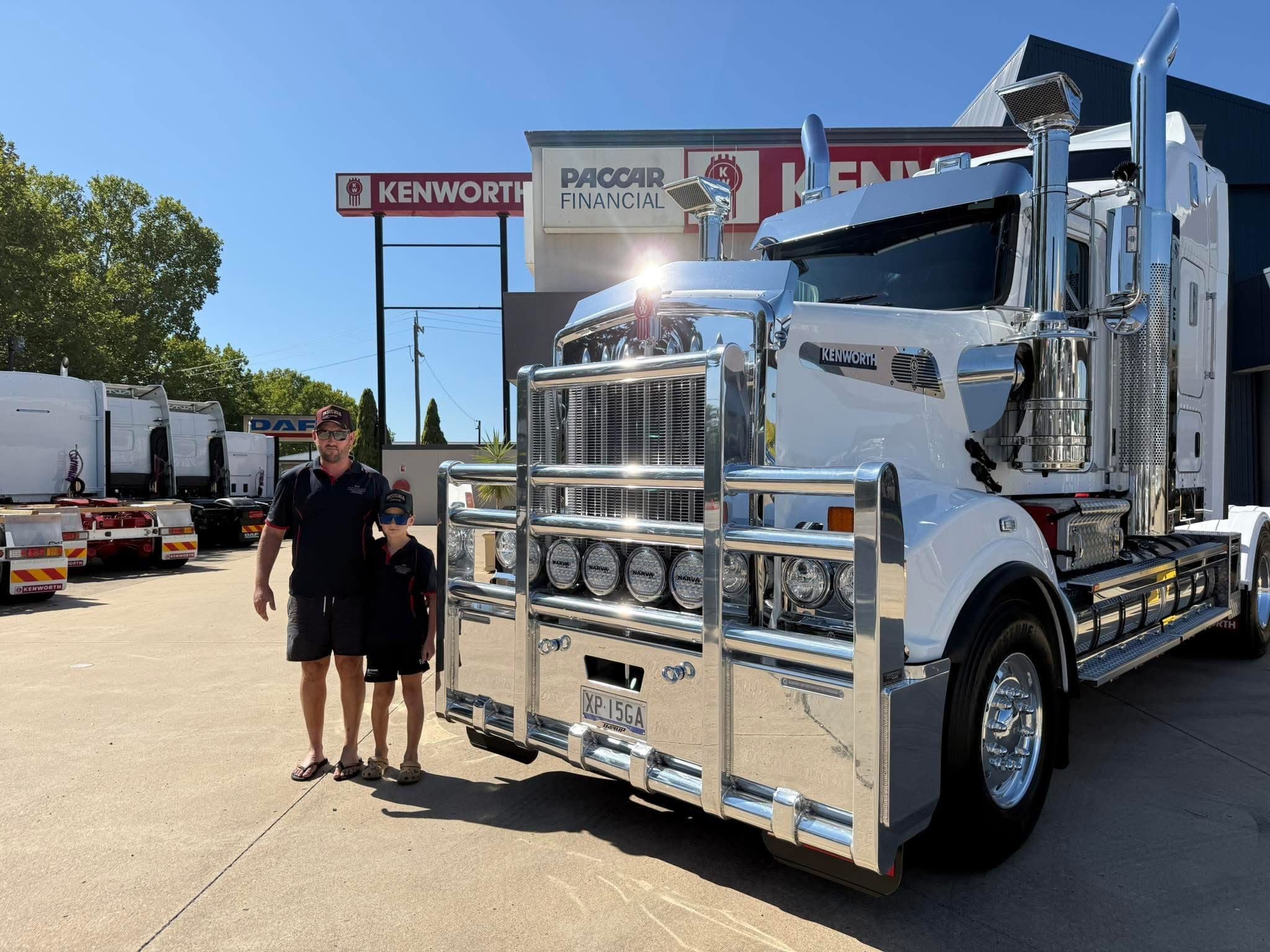 Father and son at the Kenworth dealership — dealer-customer relationship