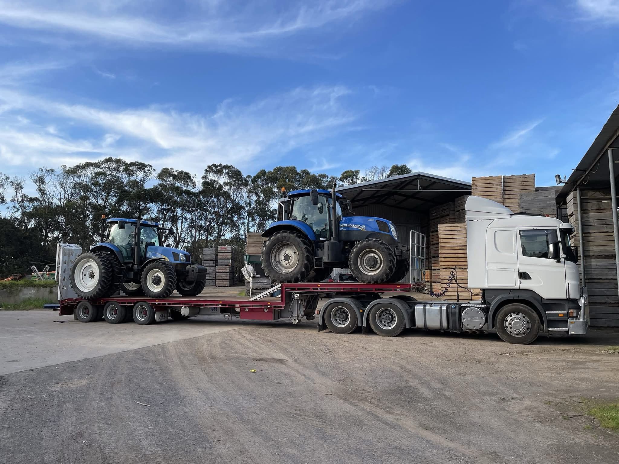 New Holland tractors on a float