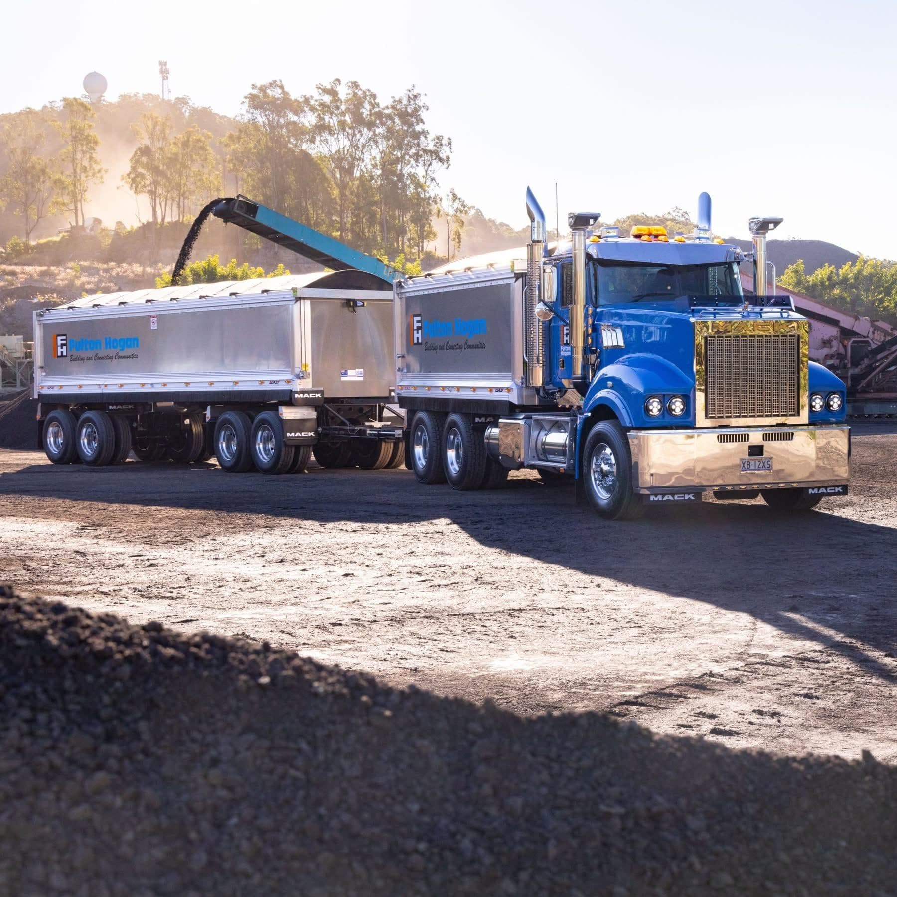Mack truck loading in dust — private sale truck finance