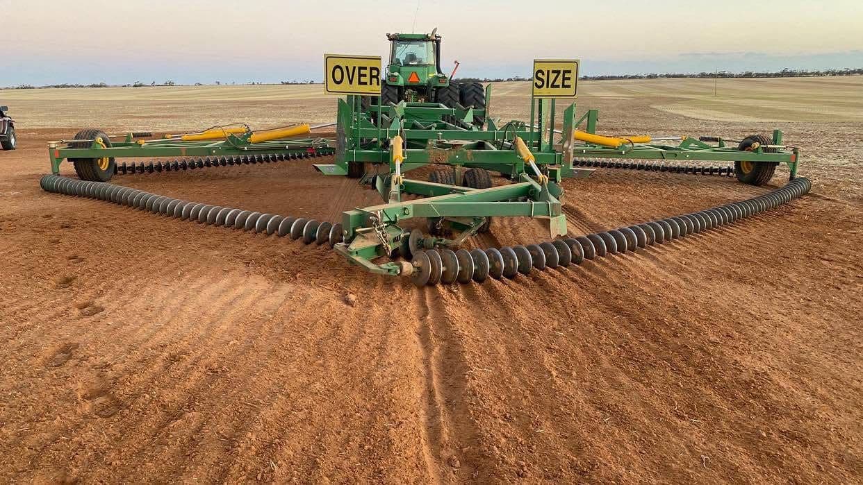 John Deere air seeder at dusk — seasonal ag finance